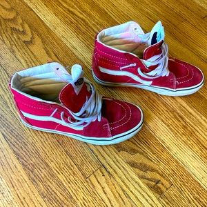 Red and white Vans high tops